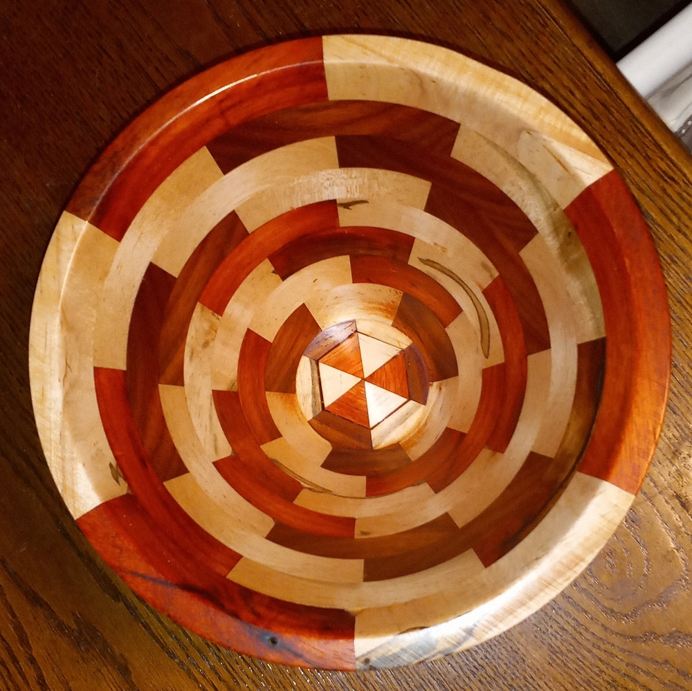Segmented padauk and maple centerpiece . Handcrafted bowl